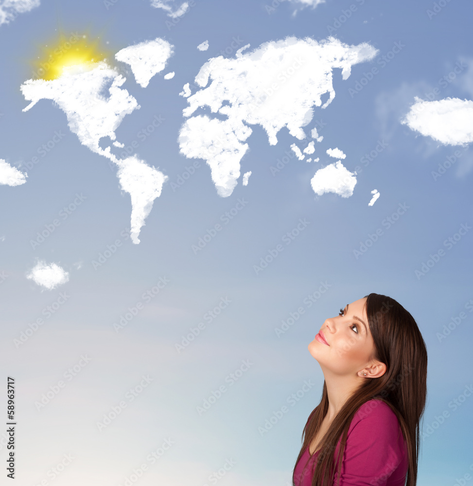 Young girl looking at world clouds and sun on blue sky