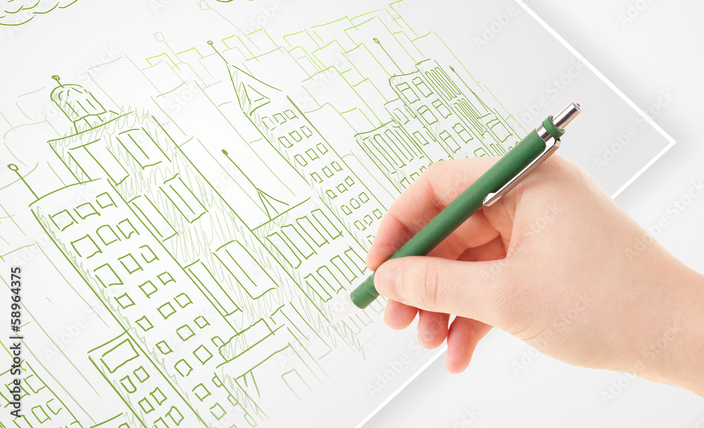 A person drawing sketch of a city with balloons and clouds on a A person drawing sketch of a city with balloons and clouds on a