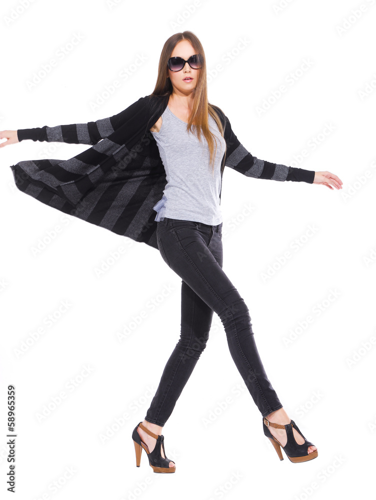 full length Slim pretty young girl in sunglasses walking full length Slim pretty young girl in sunglasses walking