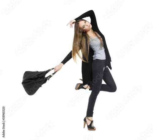Full length image of attractive young girl with bag posing