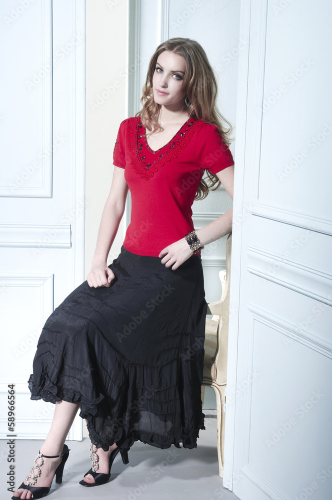young blonde girl in red dress sitting in old chair studio shoot young blonde girl in red dress sitting in old chair studio shoot