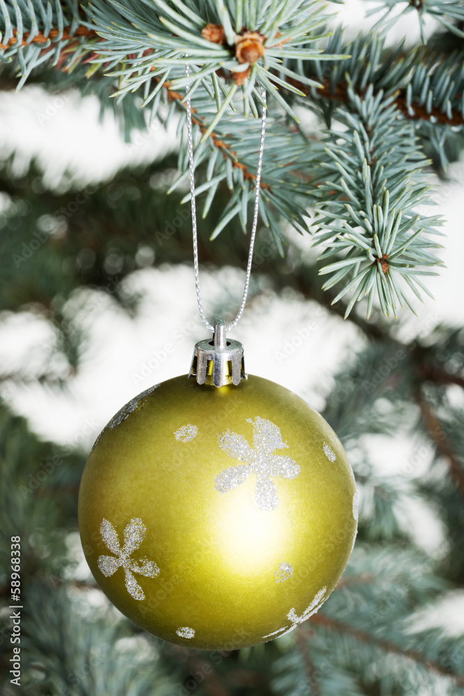 One separated christmas ball handing on a twig. One separated christmas ball handing on a twig.