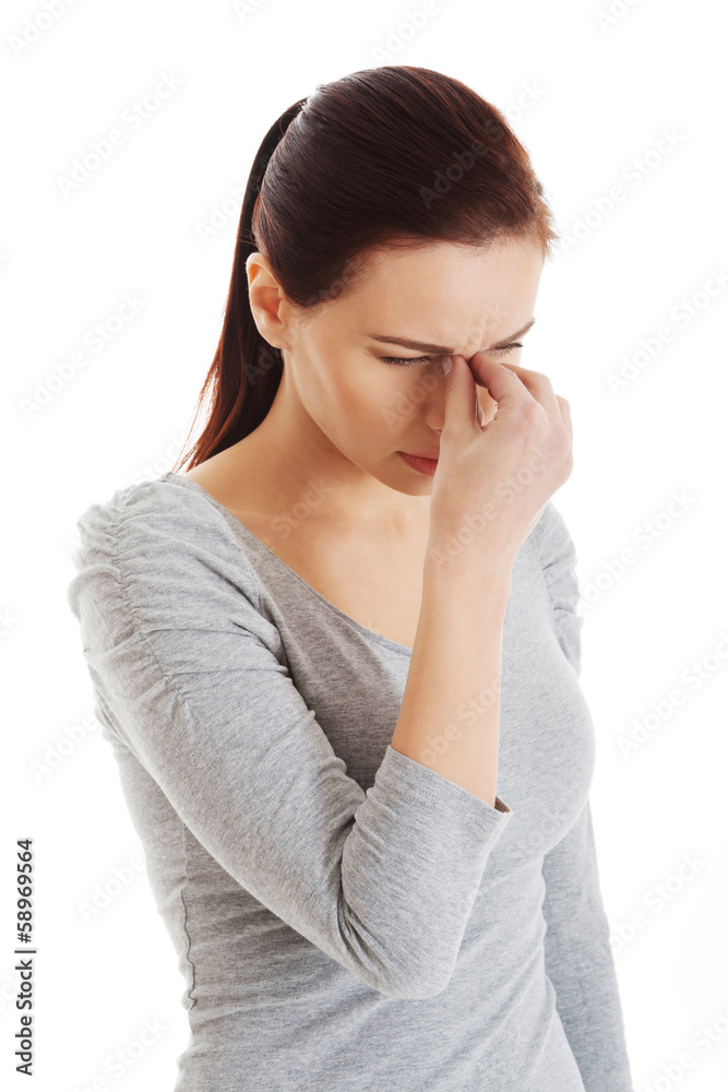 Young beautiful woman touching her nose. Young beautiful woman touching her nose.