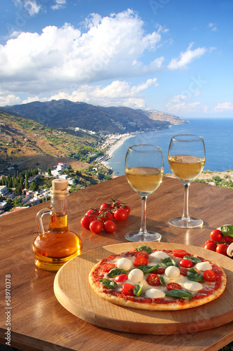 Sicily with pizza and white wine, Taormina, Italy