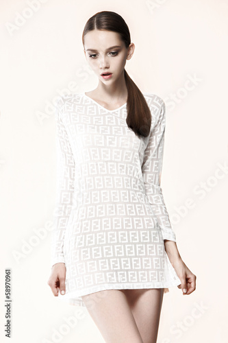 Fashion model pose on gray background