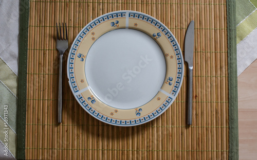 Plate and cuttlery on the table photo