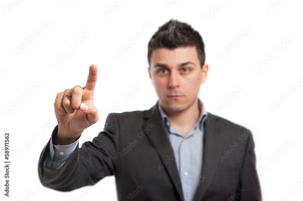 Young businessman indicating with finger. Young businessman indicating with finger.