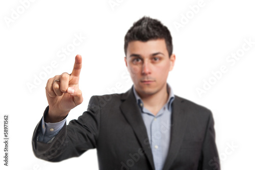 Young businessman indicating with finger.