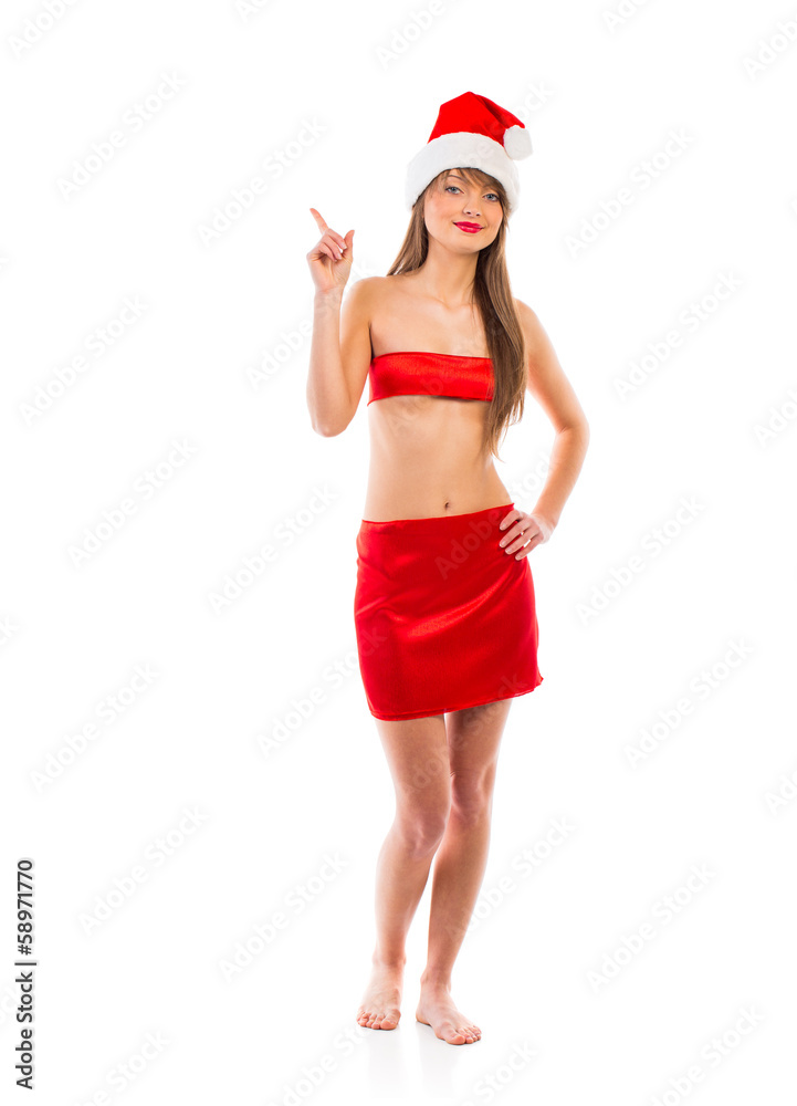 Beautiful Santa christmas girl points finger isolated on white Beautiful Santa christmas girl points finger isolated on white