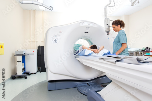 Nurse Preparing Patient For CT Scan Test photo