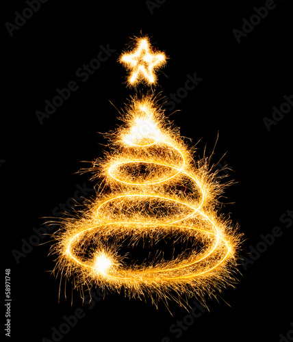 Christmas tree made by sparkler on a black