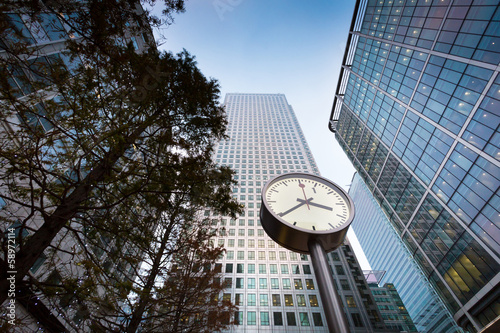 Clock in front of business building in Canary Wharf