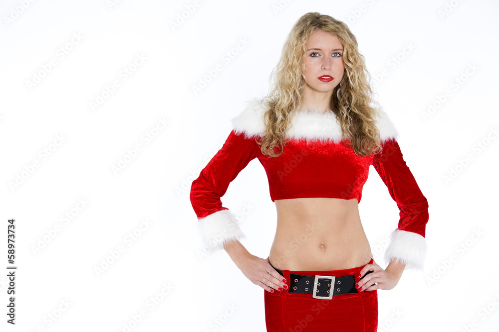 Junge blonde Frau im Weihnachtskostüm guckt zum Betrachter Junge blonde Frau im Weihnachtskostüm guckt zum Betrachter