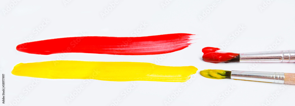 Fototapeta premium Paint brushes and paint isolated on a white