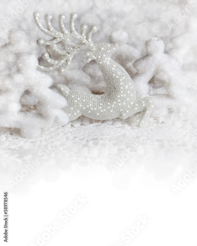 Christmas background with a toy in the form of a deer