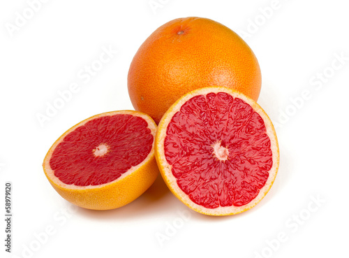 cut red grapefruit isolated on white