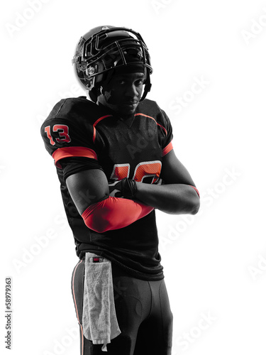 american football player standing arms crossed silhouette