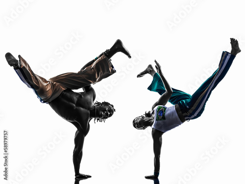 couple capoeira dancers dancing silhouette