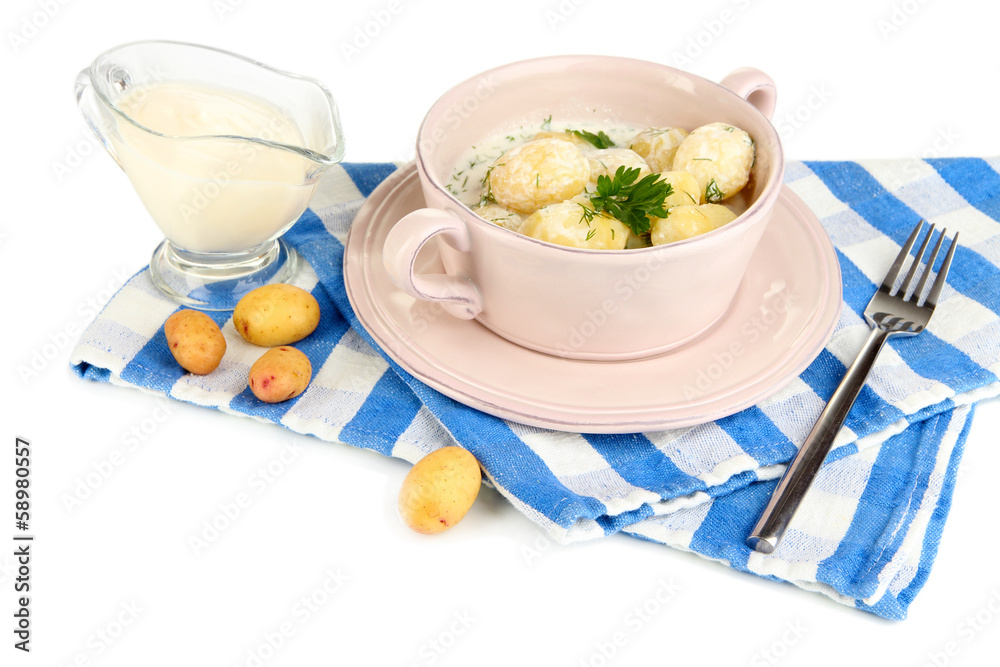 Tender young potatoes with sour cream and herbs in pan isolated Tender young potatoes with sour cream and herbs in pan isolated