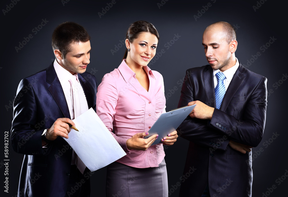 Businesswoman leader on the foreground of his team Businesswoman leader on the foreground of his team