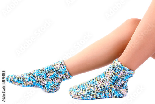Female legs in colorful socks, isolated on white
