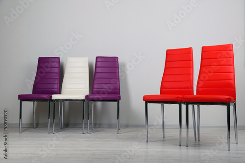 Modern  color chairs on wall background