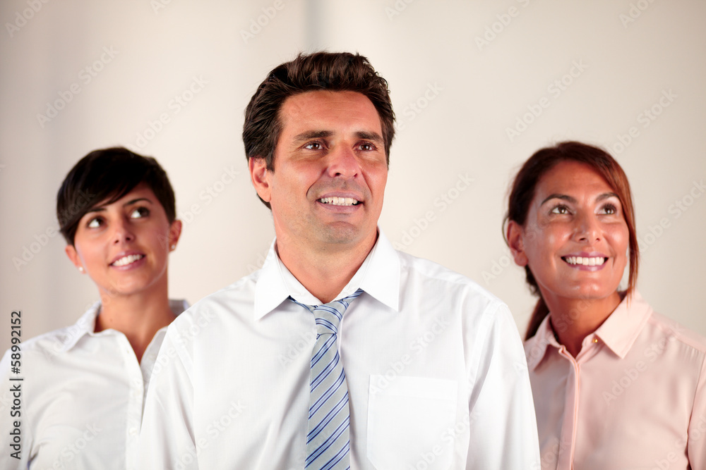 Employee team smiling and looking at people Employee team smiling and looking at people