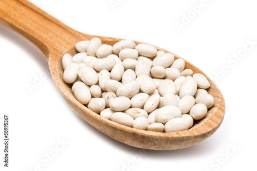 Wooden Spoon With White Beans On White Background
