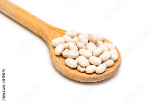 Wooden Spoon With White Beans On White Background