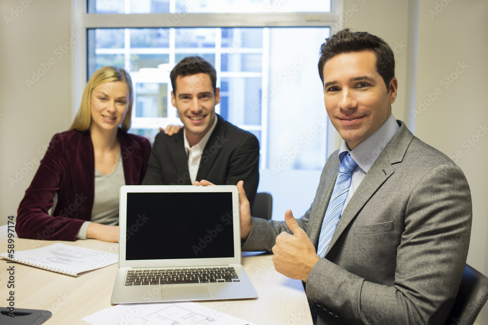 Real-estate agent presenting a new project on laptop Real-estate agent presenting a new project on laptop