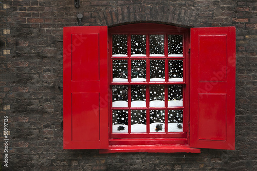 window with red blind with Christmas decoration. photo