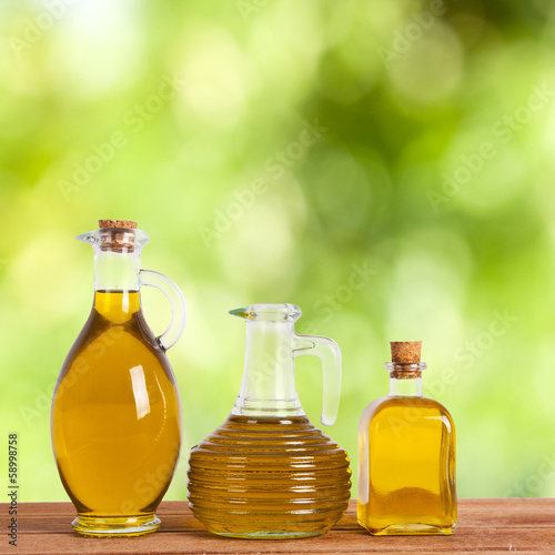 bottles of olive oil with natural background