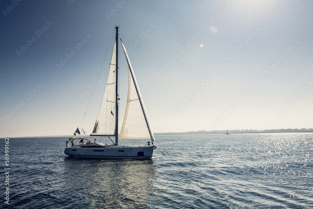 Sailing ship yachts with white sails