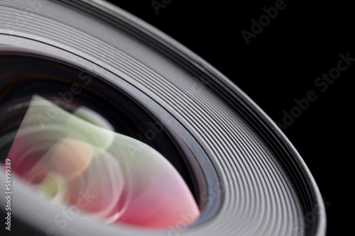 Camera lens close-up on black background