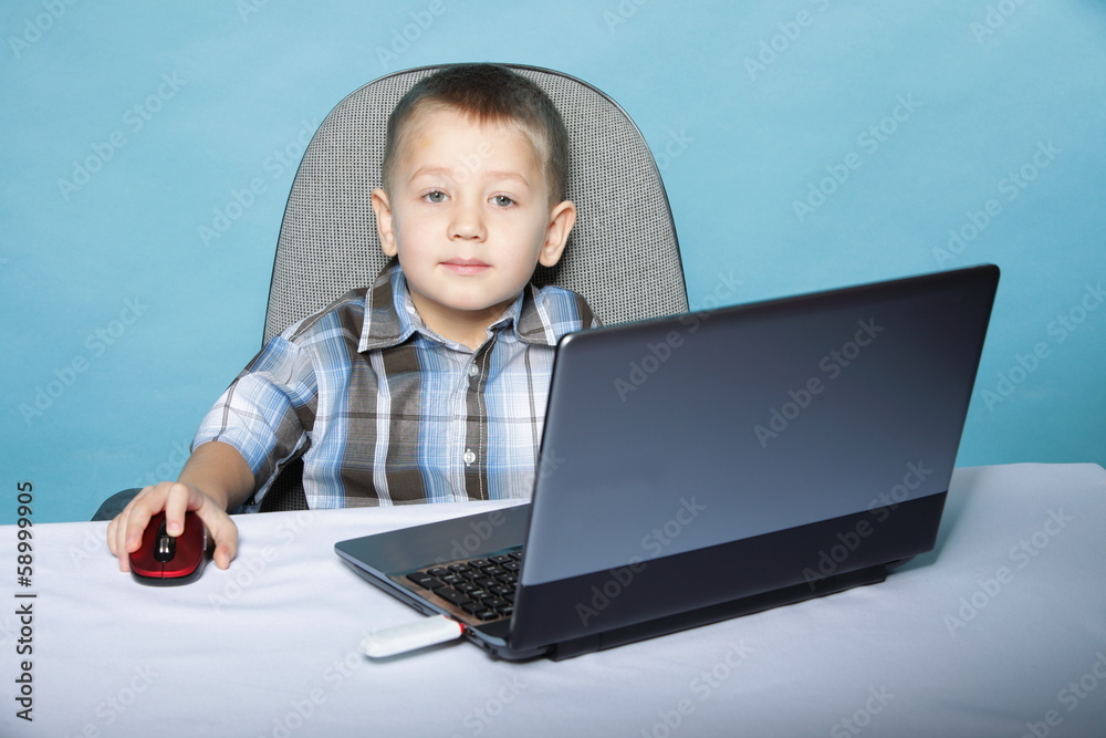 Computer addiction child with laptop notebook Computer addiction child with laptop notebook