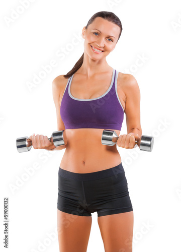 Smiling happy sport female with dumbbells isolated on white © mihalec
