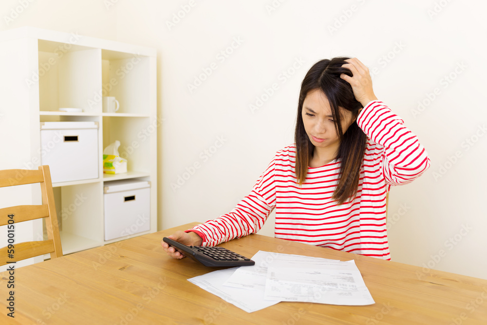 Asian woman worries about the budget Asian woman worries about the budget