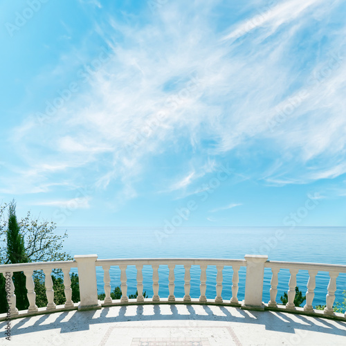 balcony over sea and cloudy sky