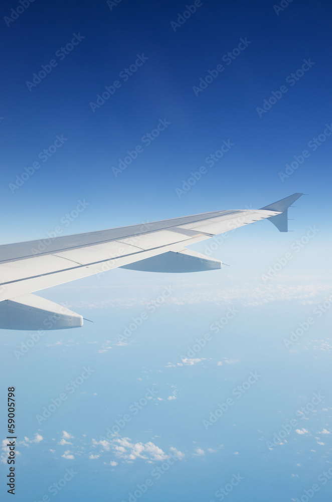 Airplane wing out of window Airplane wing out of window