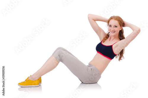 Young sporty woman doing exercises on white