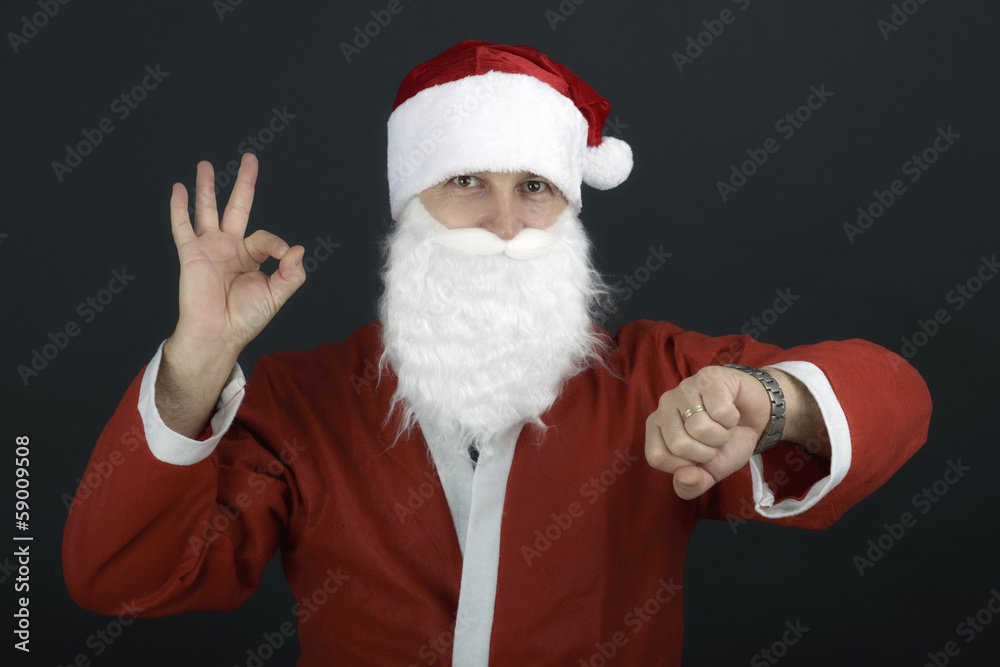 Portrait of Santa Claus with a bag of presents and looking at hi Portrait of Santa Claus with a bag of presents and looking at hi