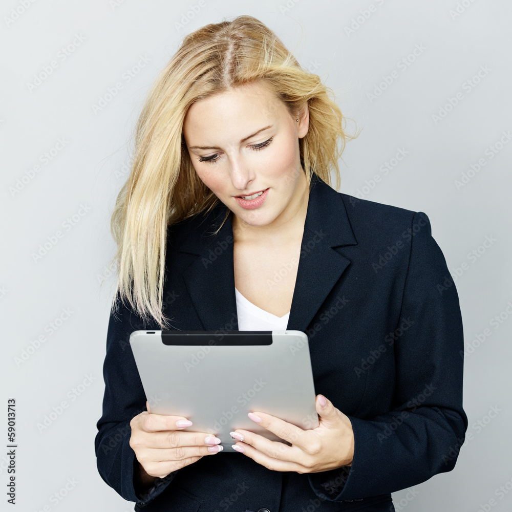 Business woman reading on touchpad Business woman reading on touchpad