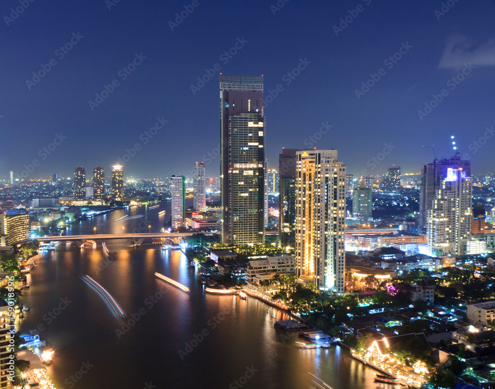 Bangkok cityscape with river at night.
