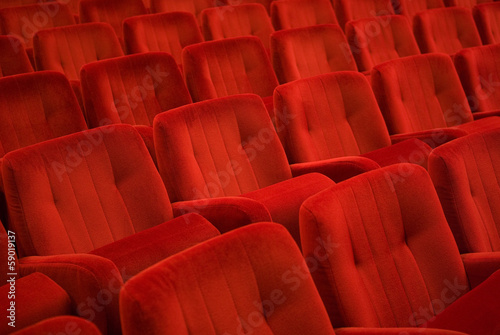 Red armchairs in theater