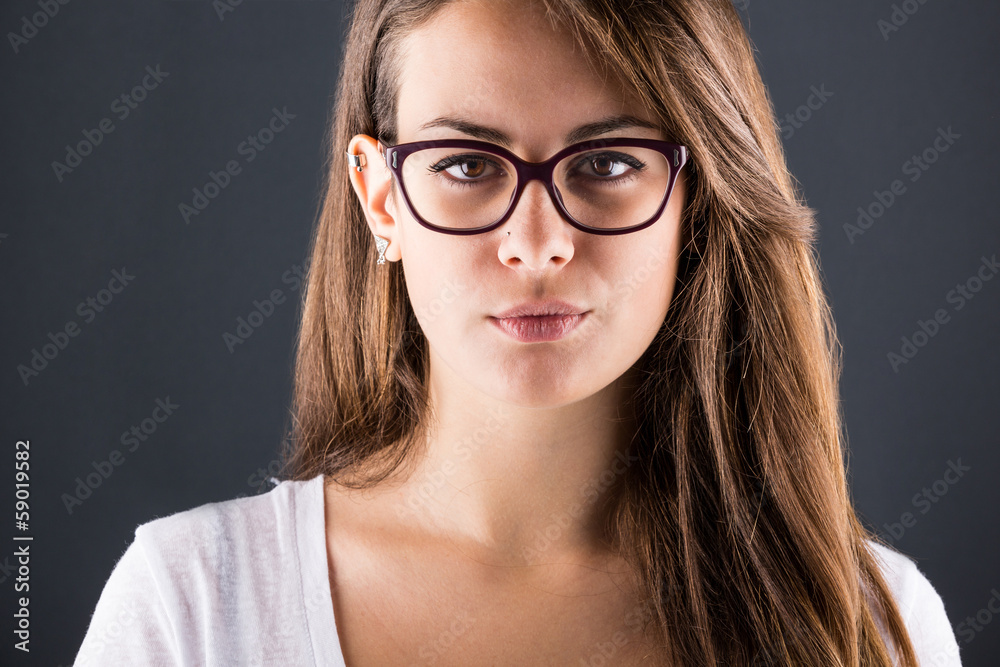 Pensive Young Woman on Dark Background