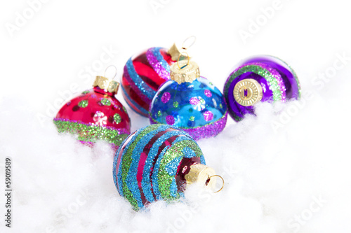 Colorful glitter Christmas balls over white background