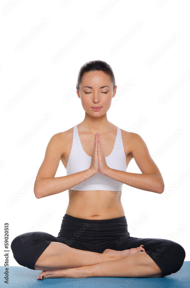 Asian woman sitting in lotus position Asian woman sitting in lotus position