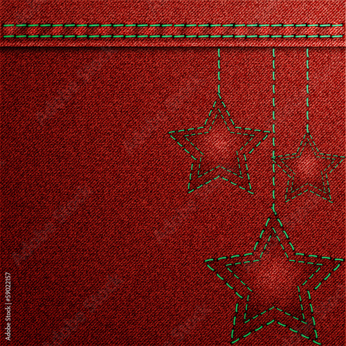 Red denim Christmas background with embroidery.