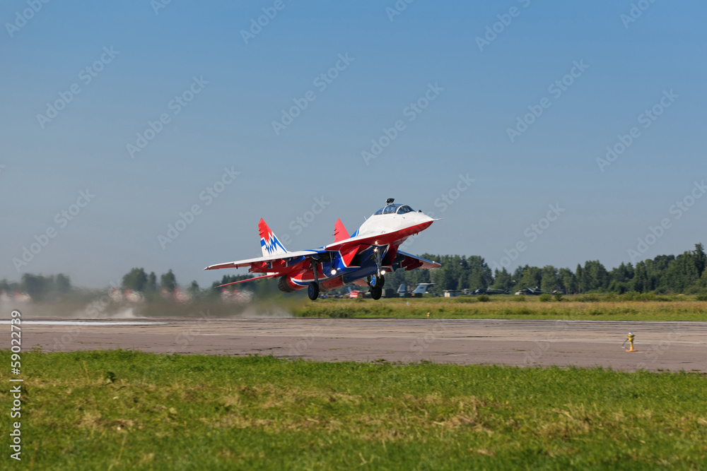 Military plane taking off from the airfield