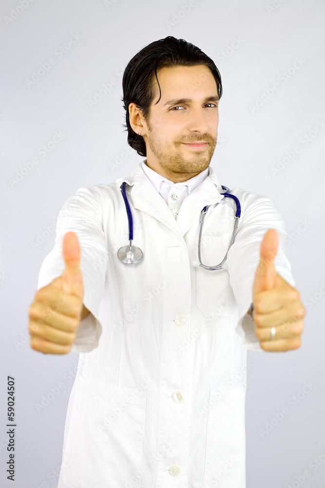 Happy doctor showing thumb up confident of success Happy doctor showing thumb up confident of success